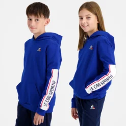 SWEAT LE COQ SPORTIF A CAPUCHE JUNIOR TRICOLORE